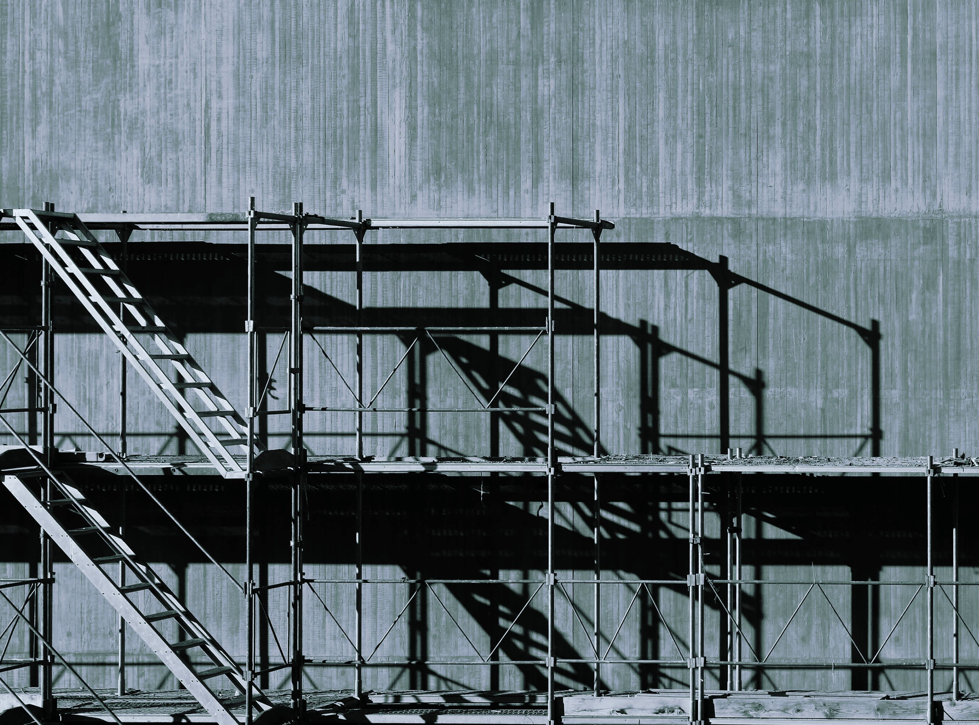 grayscale photography of piled racks