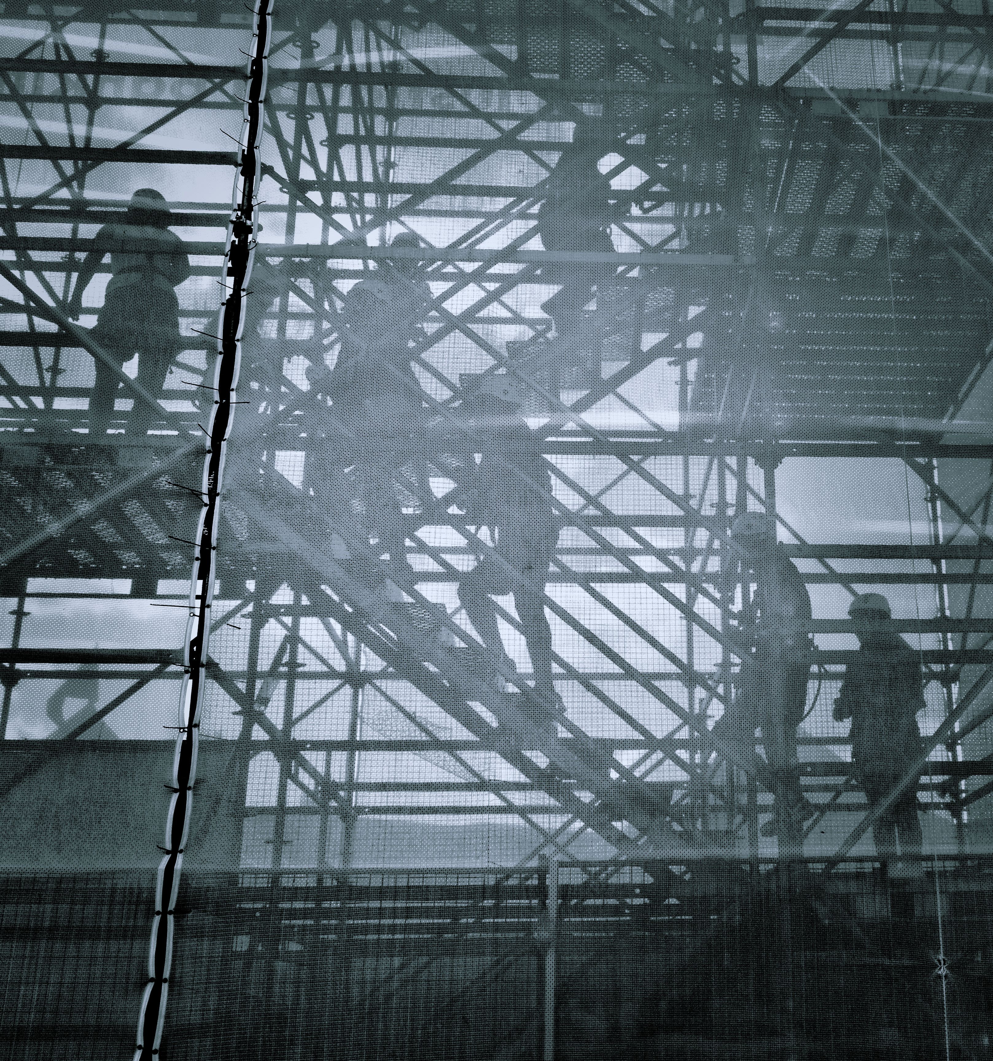 black and white photo of people going upstairs
