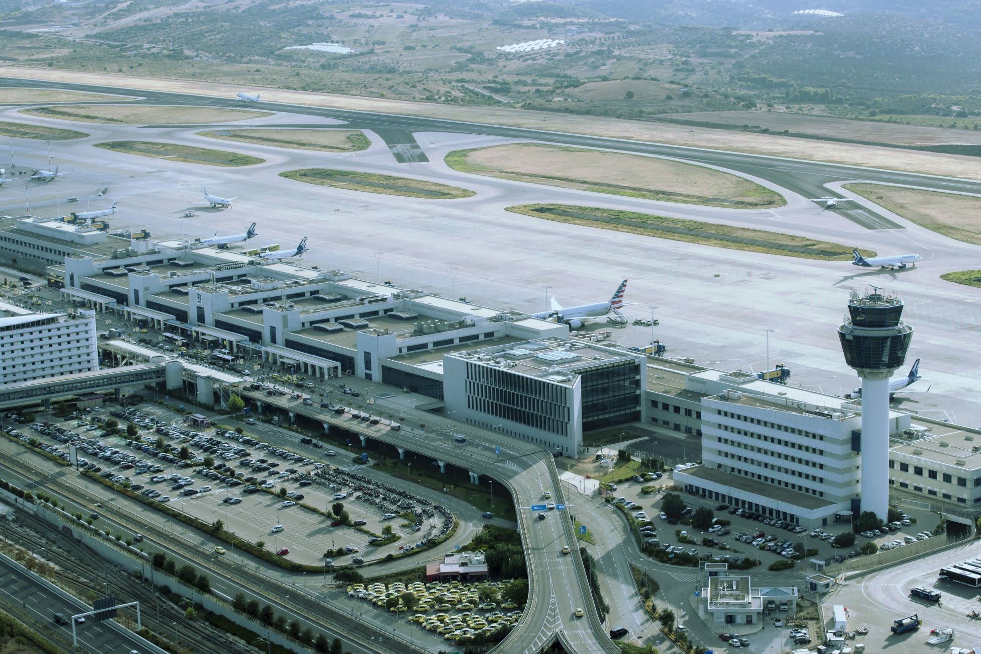 a view of an airport with a tower in the background