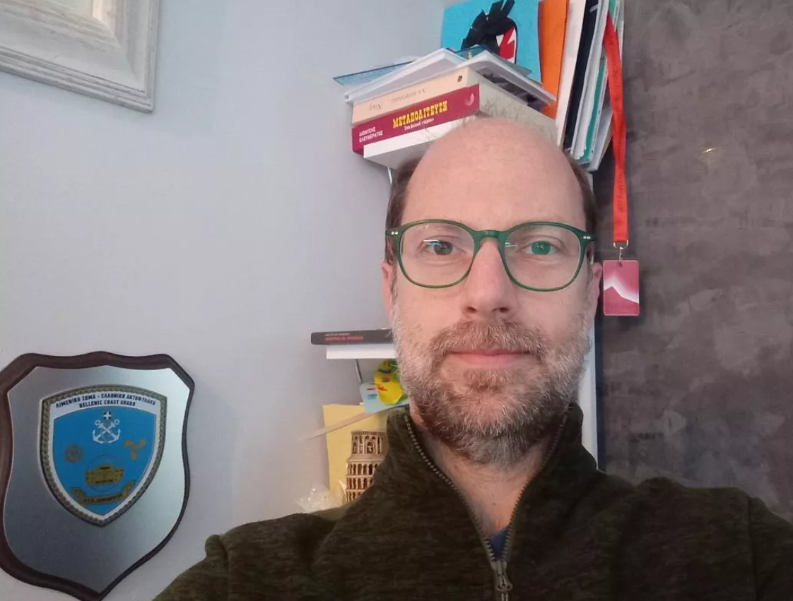 white and black ship surrounded by body of water