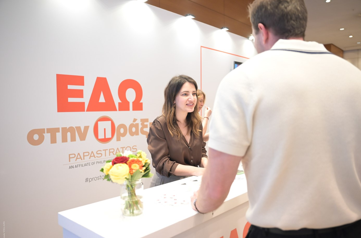 selective focus photography of people sits in front of table inside room