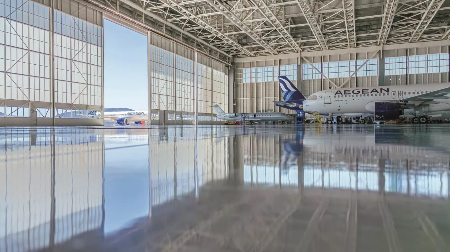 windmills on grass field at daytime